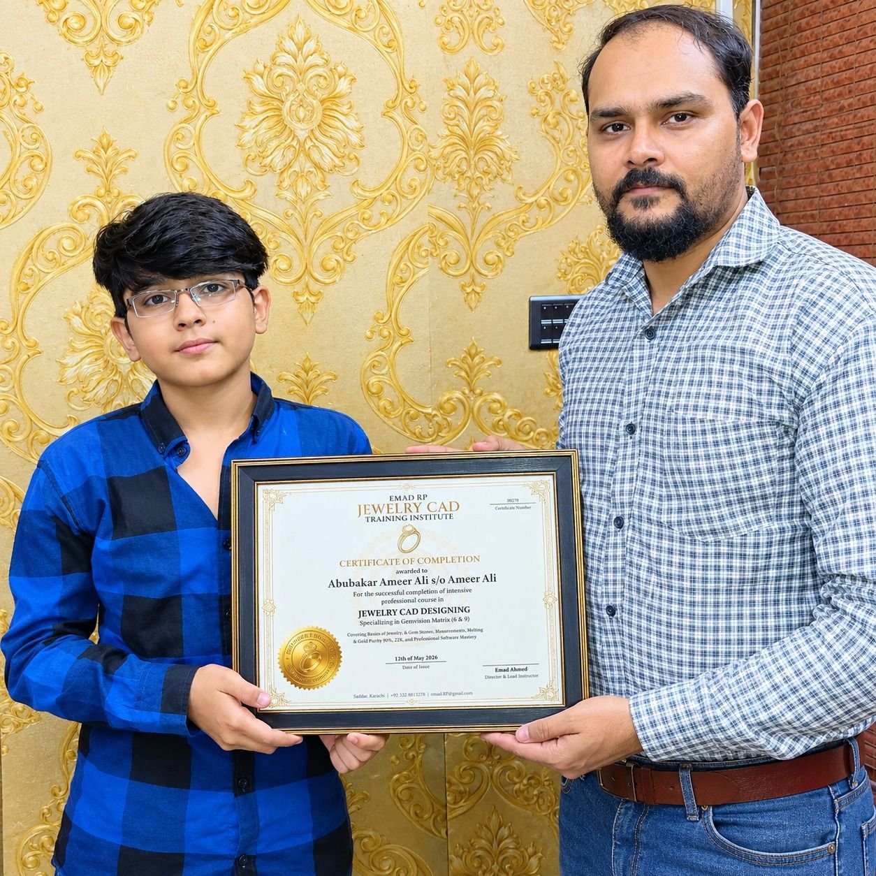 Emad Ahmed awarding a certificate to a student